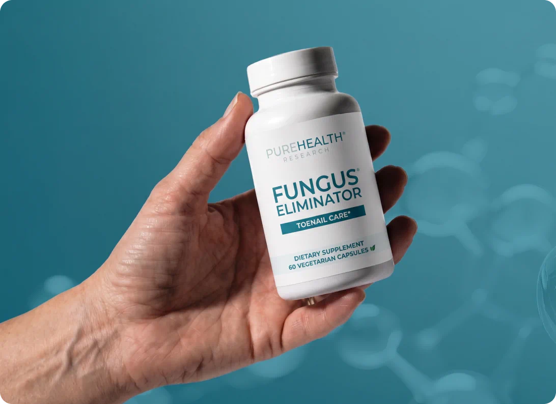 Hand holding Fungus Eliminator bottle